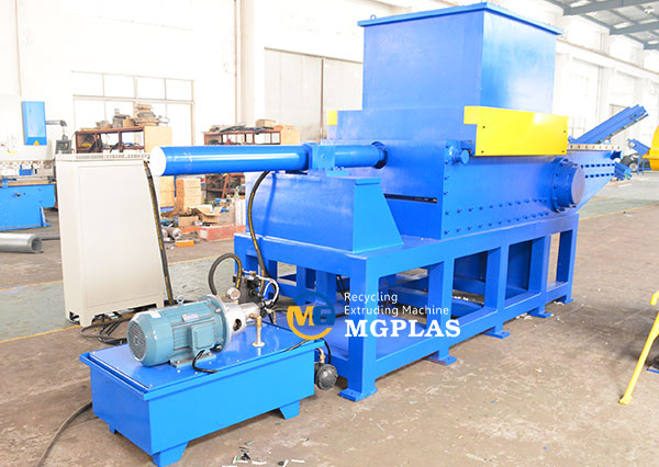 Large diameter plastic pipe shredder with movable hopper and coupler